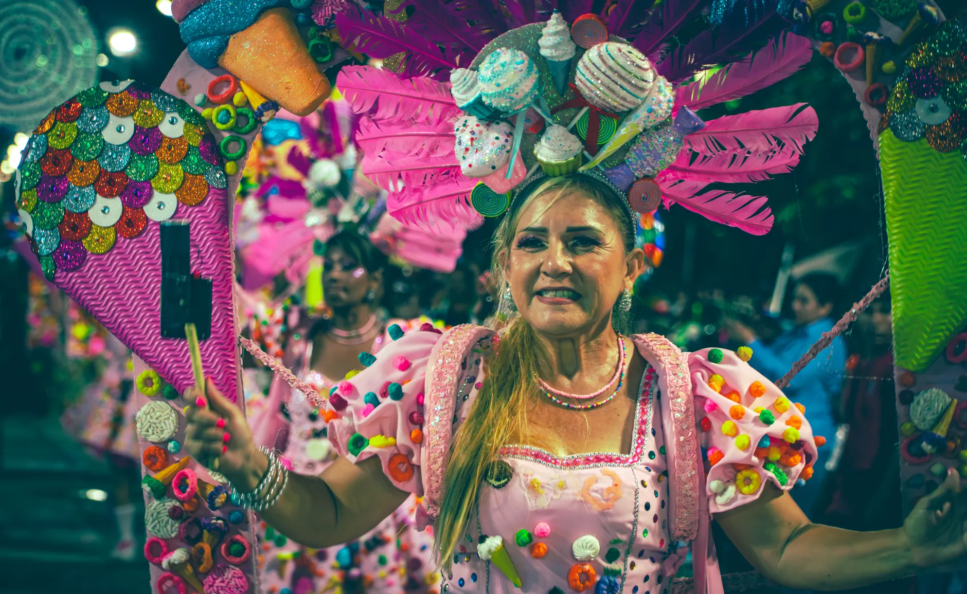 Vibrant carnival celebration in Santa Cruz featuring colorful costumes and lively parade participants.